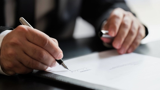 person filling out paperwork